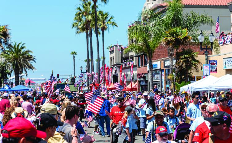 The July 4th parade in 2023 shown above and the parade in 1935 is shown below. WIRESTOCK/ DREAMSTIME.COM
