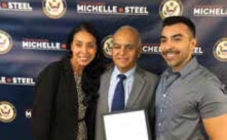 Linda Balani, Prem Balani and son Mitch Barela at the ceremony. Photo Provided,